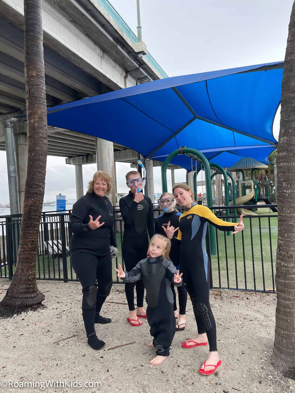 kids in wetsuits ready to go snorkeling in fort lauderdale florida
