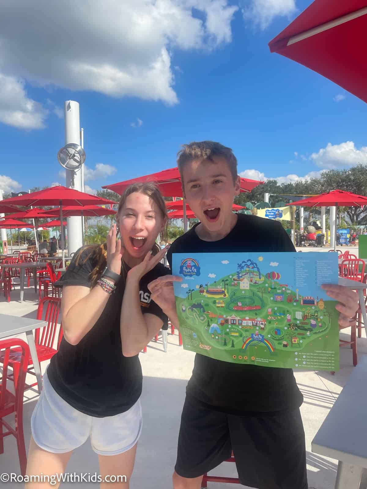 kids holding the Peppa Pig theme park in florida theme park map