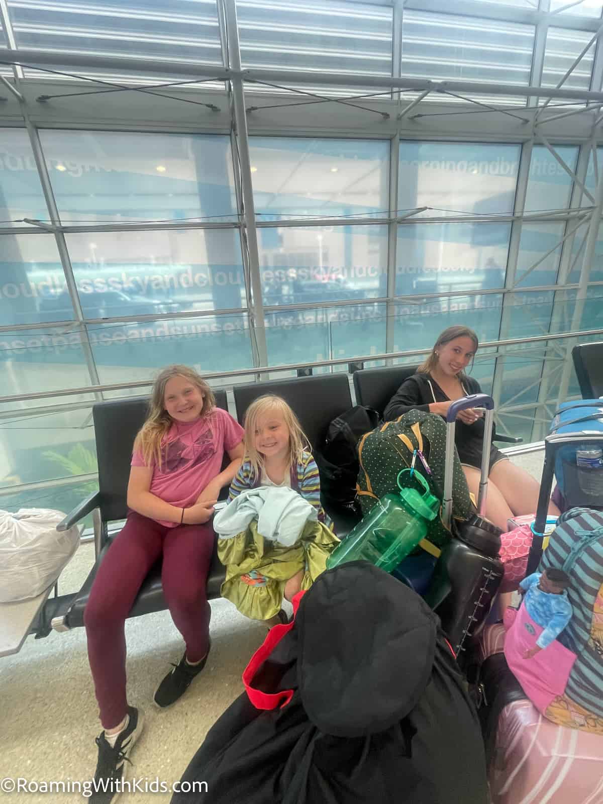Children sitting in an airport