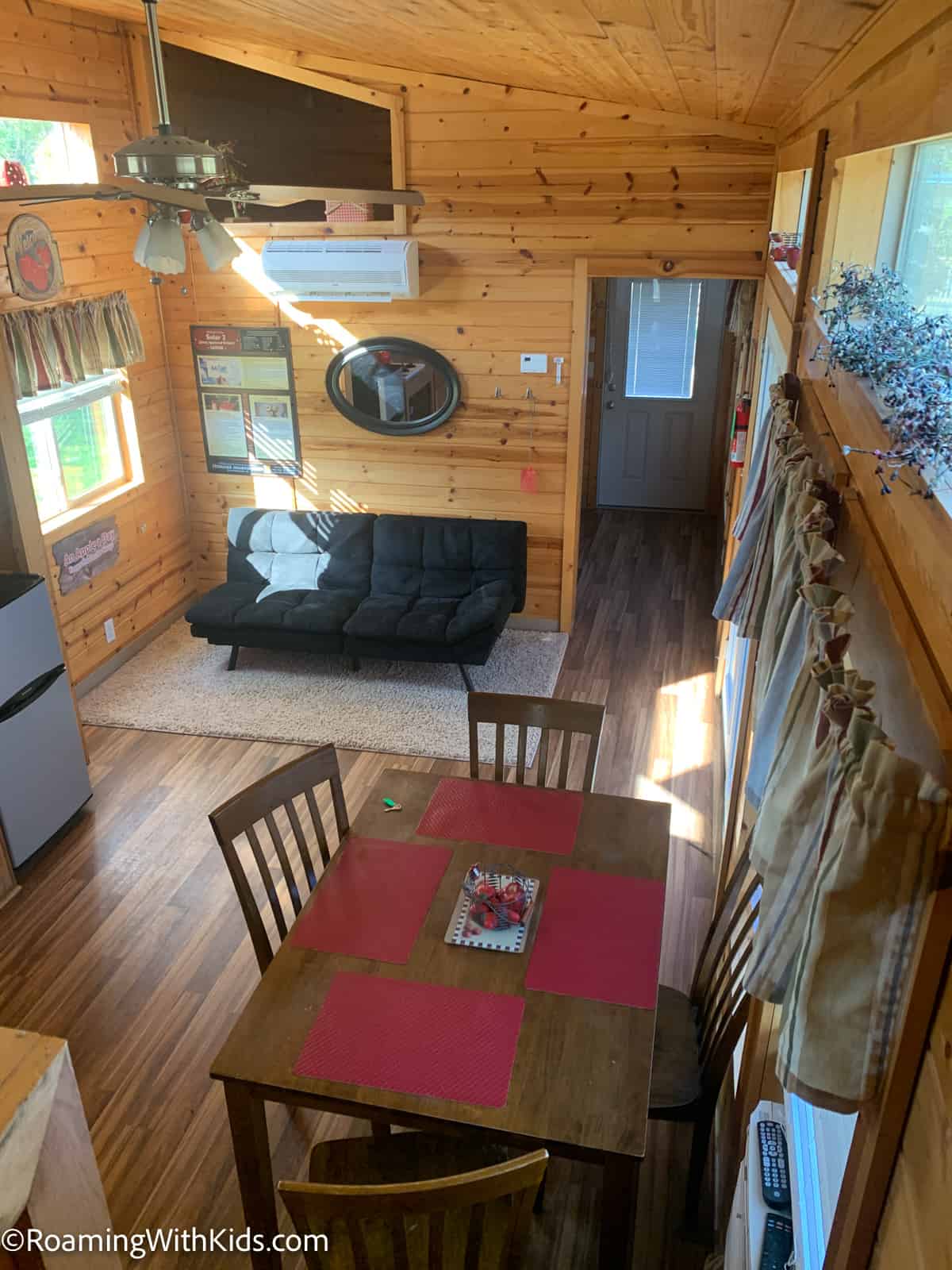 overhead photo of living room and dining room in the in solar 2 cabin at Herkimer KOA