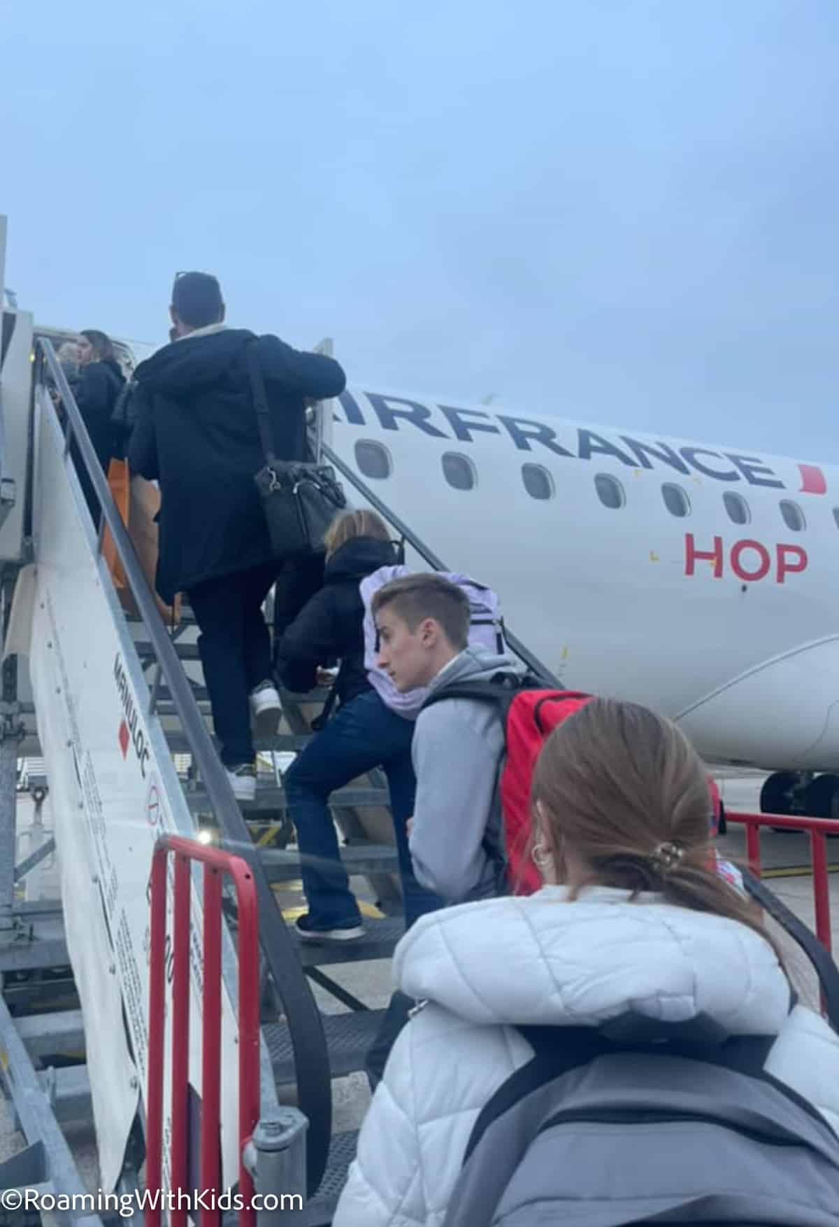 kids boarding an air france plane in paris france