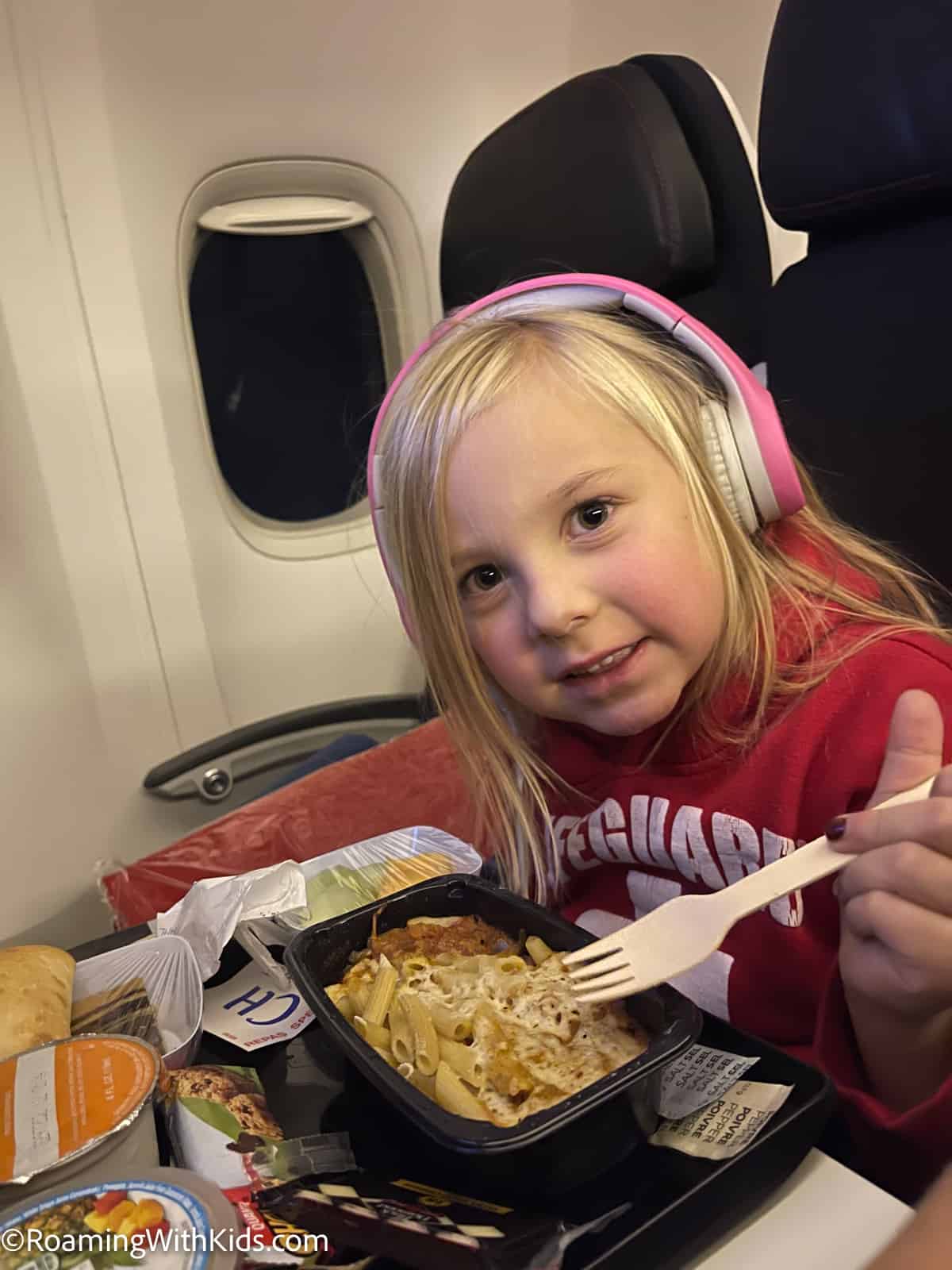 child on air france plane eating a kids meal 