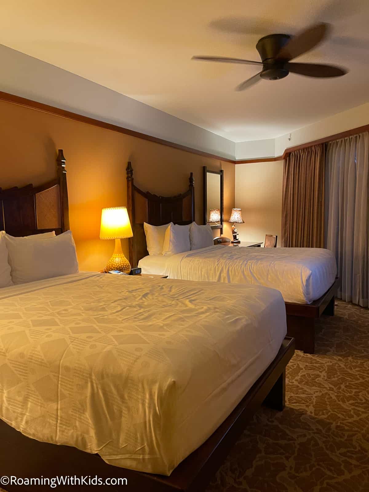 bedroom of a Disney Aulani Resort hotel room