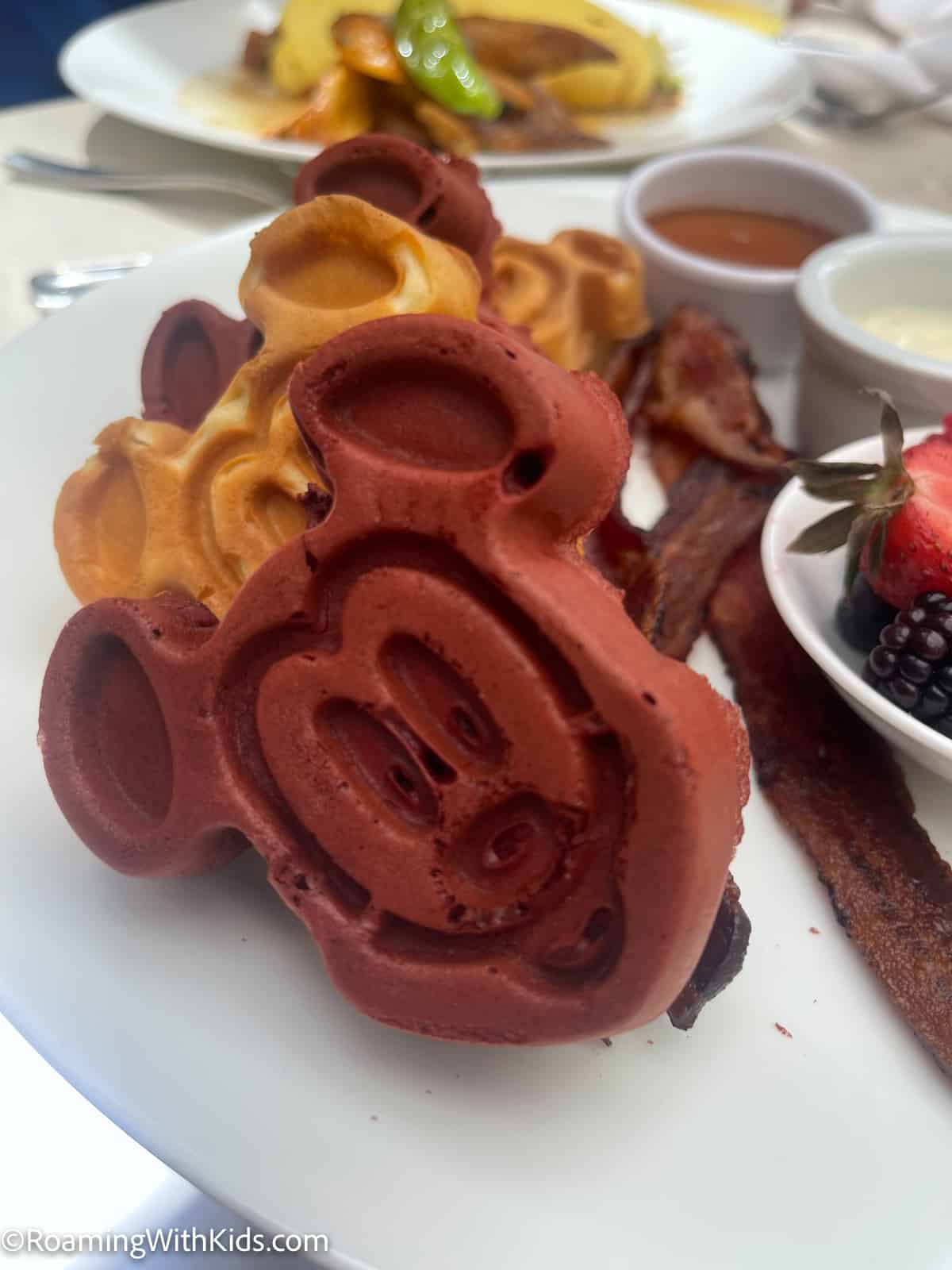 Mickey waffles and minnie waffles with bacon and fruit at the Disney Aulani resort character breakfast
