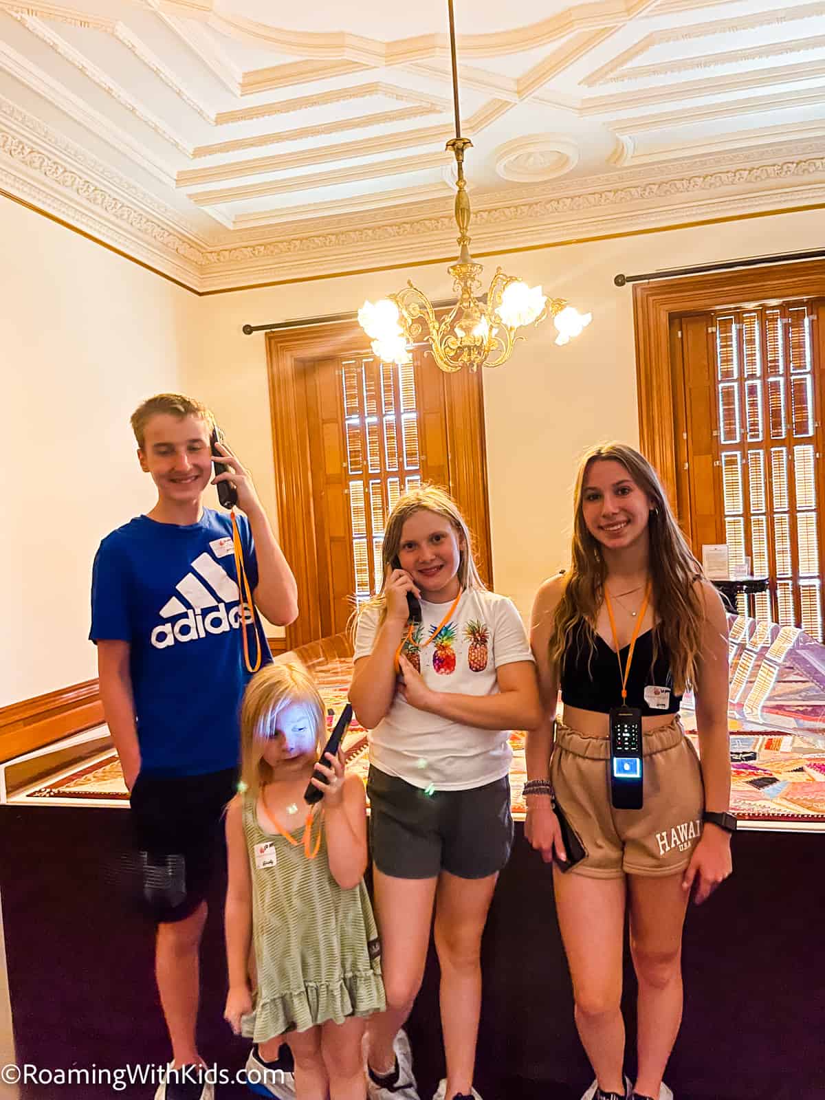 kids on a self-guided audio tour at Iolani Palace