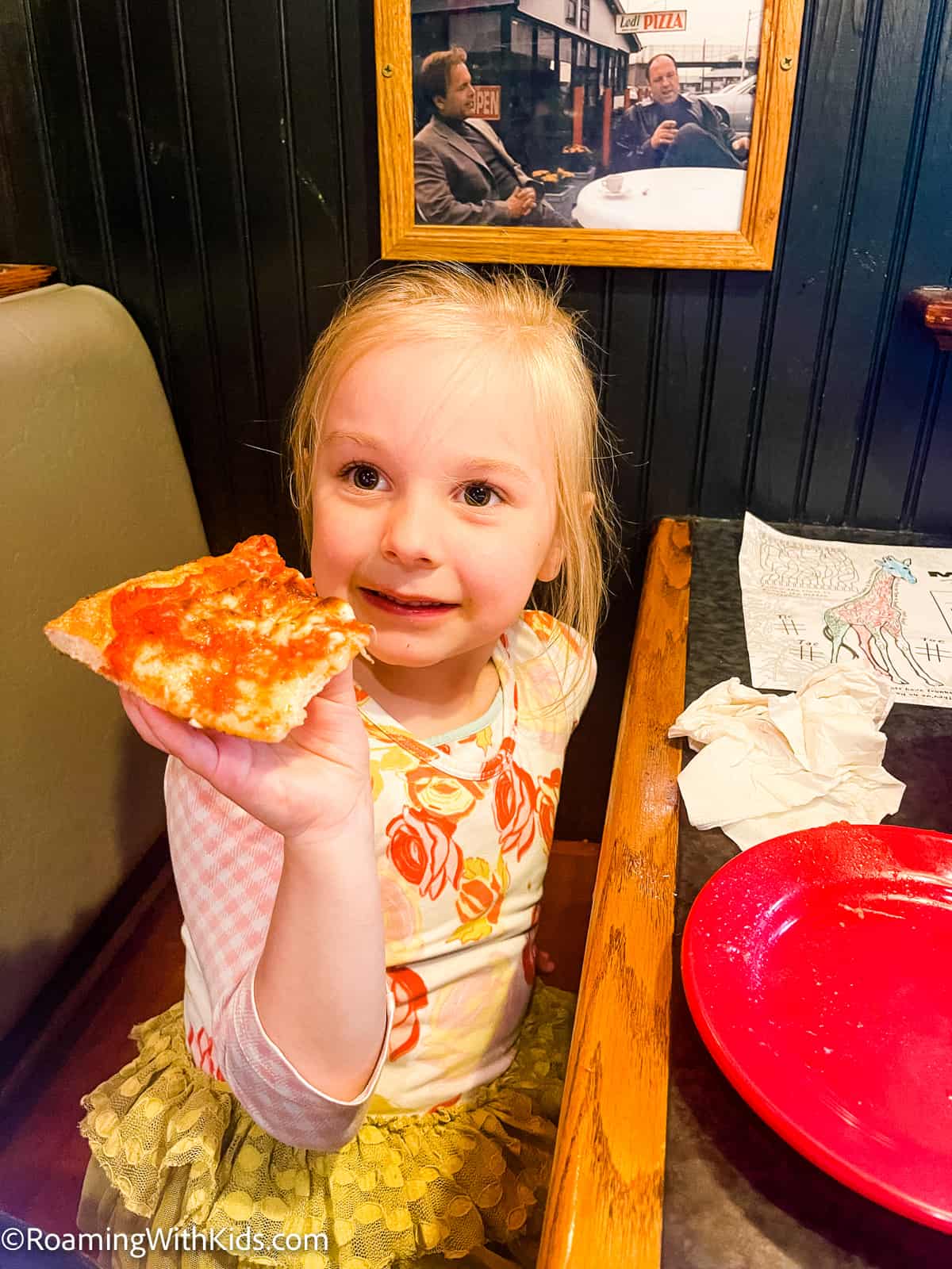 a child eating pizza at mystic pizza